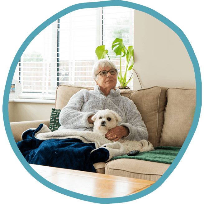 Female client with her white dog on the sofa