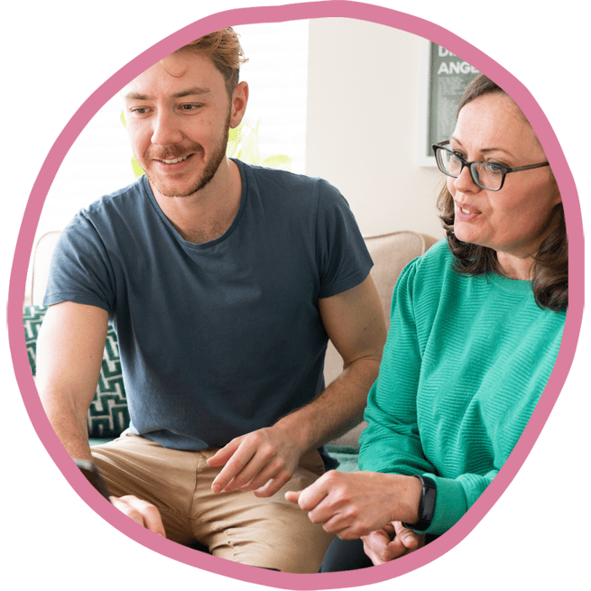 Female and male carer working together on the laptop